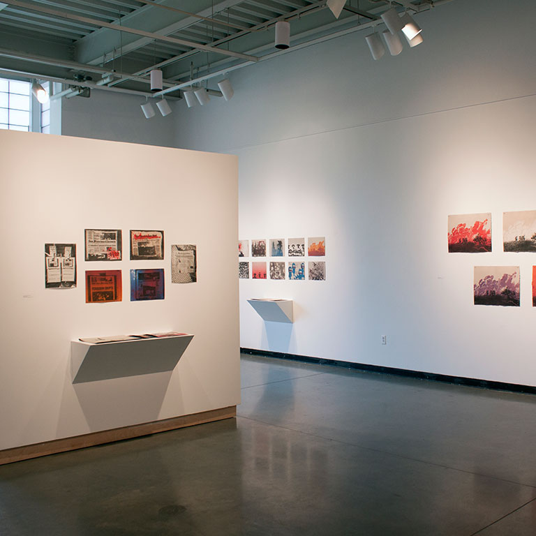 A gallery space with varied wall spaces for hanging artwork.