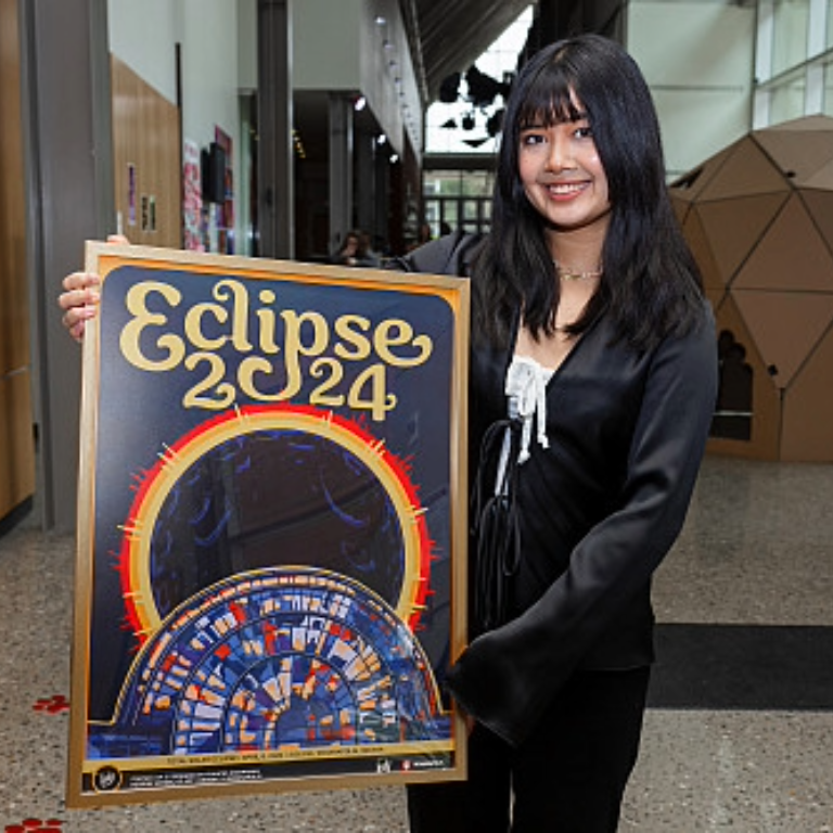 Three commemorative solar eclipse posters designed by Herron School of Art and Design students